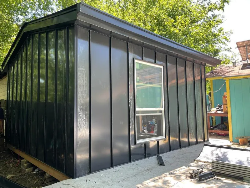 Black standing seam metal wall panels for Roof Inspection in St. Marys